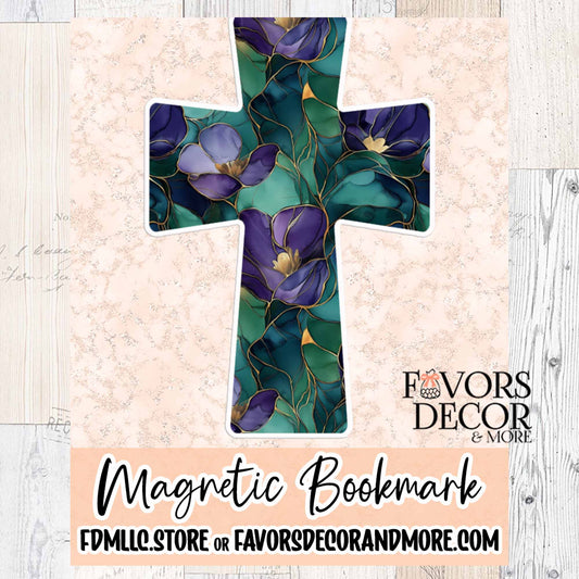 Cross-shaped magnetic bookmark with a floral design featuring purple African violets and gold-lined green leaves, displayed on a light pink textured background with the Favors Decor & More logo.