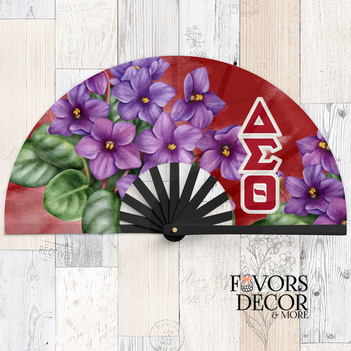 Delta Sigma Theta clack fan with bold red background, large purple African violets, and white Greek letters ΔΣΘ along the side.