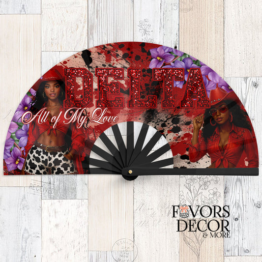 Delta Sigma Theta clack fan with two stylish women in red cowgirl outfits, glittery “DELTA” lettering, African violets, and the phrase “All of My Love” on a bold red background.