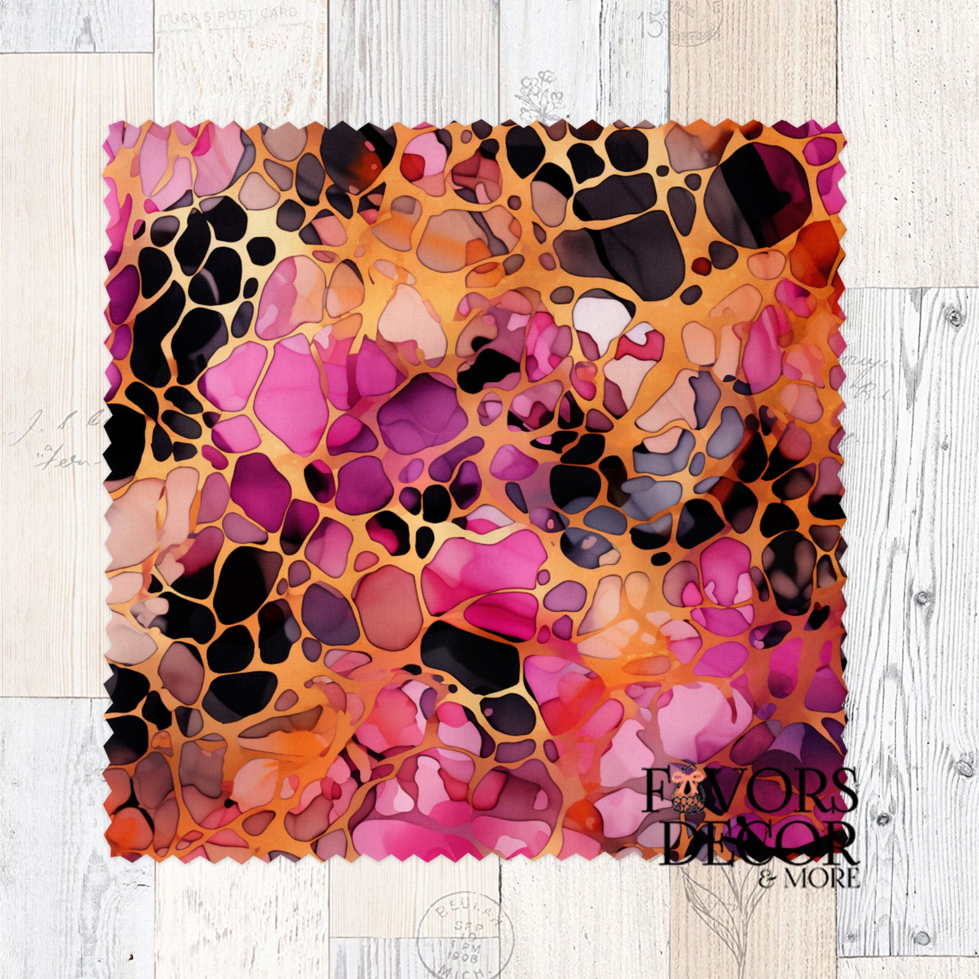 Microfiber lens cleaning cloth with bold leopard print in berry pink, orange, and black tones on a scalloped square design by Favors Decor and More.