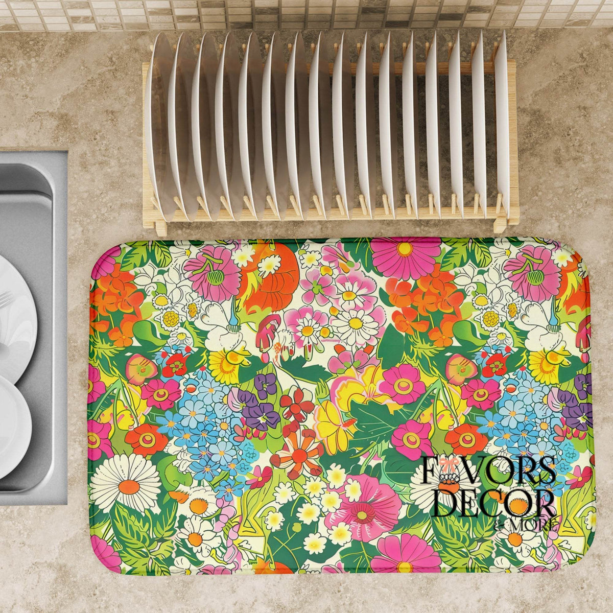 Floral patterned mat on a kitchen counter with a dish rack in the background