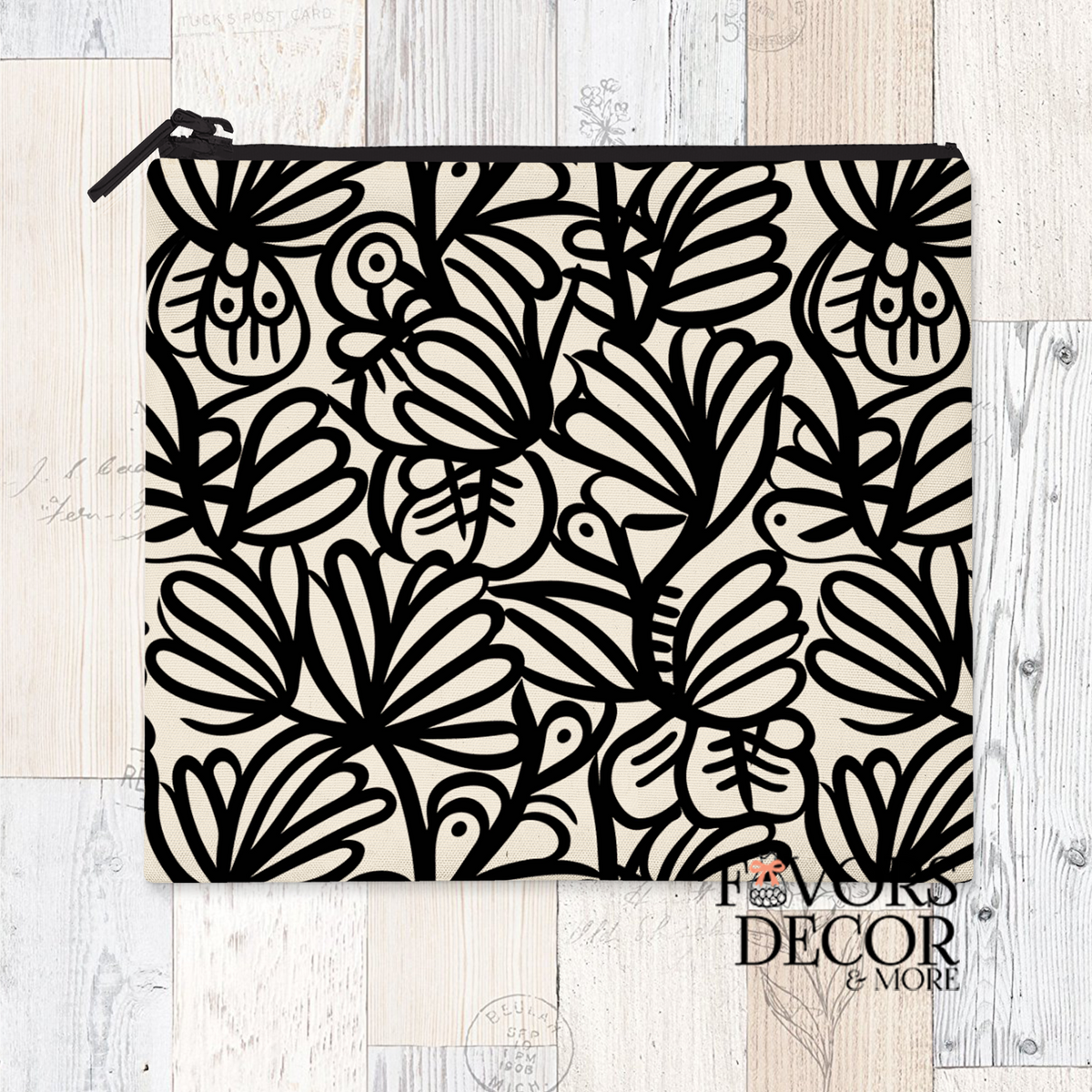 A reusable sandwich pouch featuring a black and white abstract botanical or leaf pattern on the exterior. The pouch has a white zipper closure and is made with a food-safe PUL fabric lining.