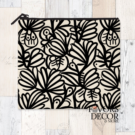 A reusable sandwich pouch featuring a black and white abstract botanical or leaf pattern on the exterior. The pouch has a white zipper closure and is made with a food-safe PUL fabric lining.