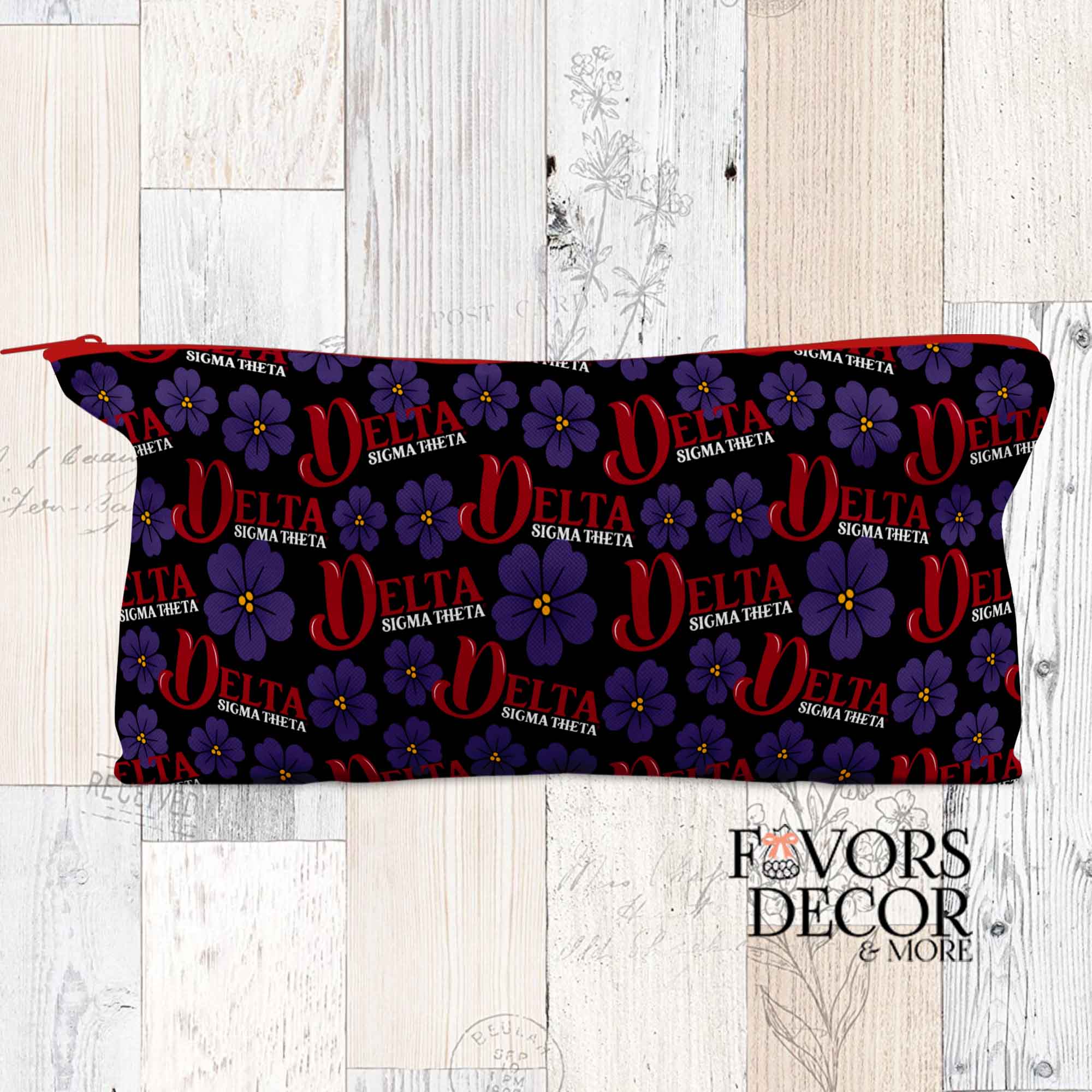 Black pencil pouch featuring red Delta Sigma Theta logos and purple violets with a red zipper.