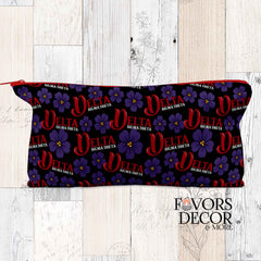 Black pencil pouch featuring red Delta Sigma Theta logos and purple violets with a red zipper.
