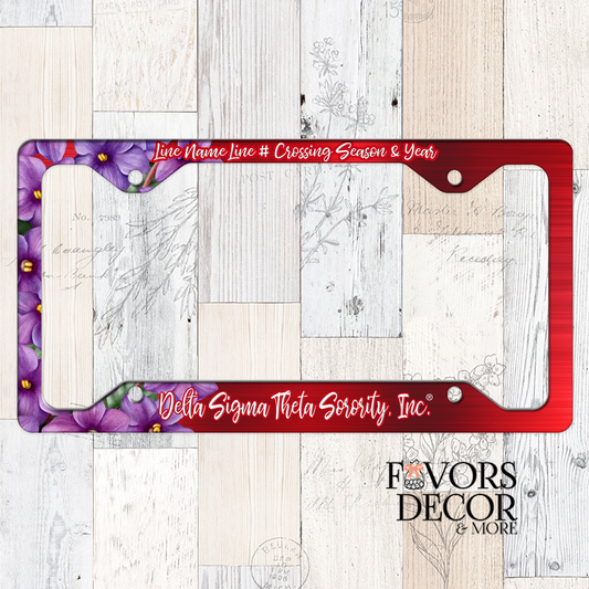 License plate frame with purple floral design and red border on a wooden surface, featuring Delta Sigma Theta Sorority, Inc. branding.