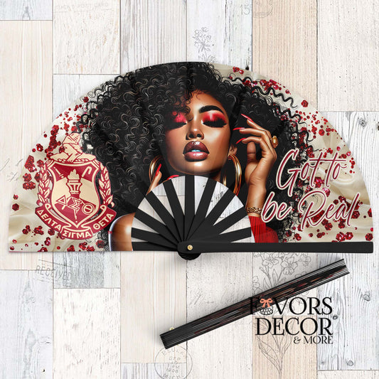 Delta Sigma Theta clack fan with bold red and black design, featuring a stylish woman with curly hair, red makeup, sorority shield, and text "Got to Be Real."