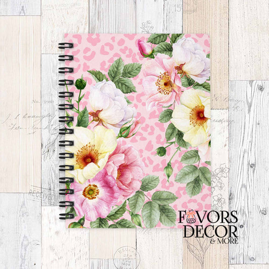 Safari Bloom spiral notebook with bright pink, yellow, and white flowers over a soft pink animal print background – fun and feminine design.