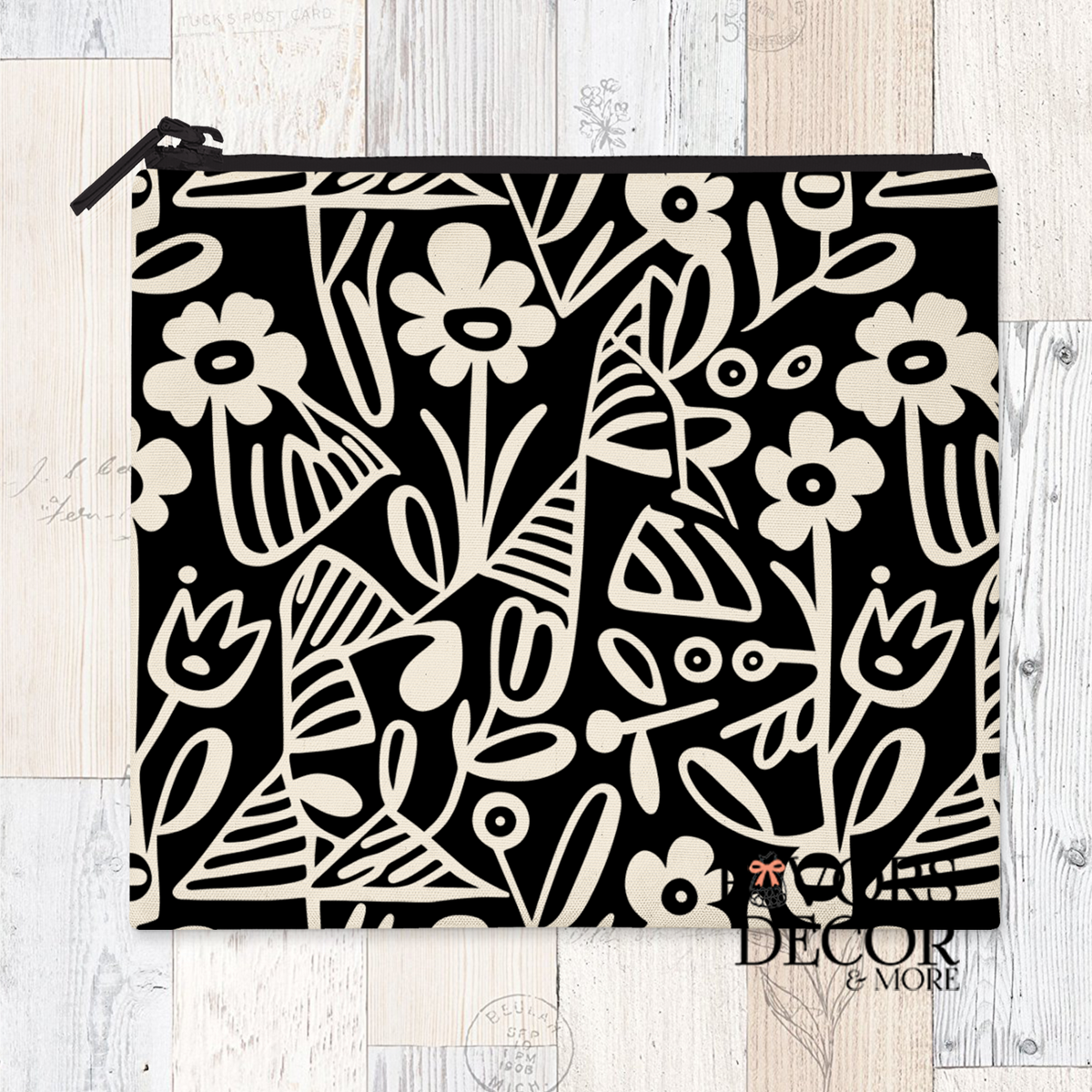 A reusable sandwich pouch featuring a black and white abstract botanical or leaf pattern on the exterior. The pouch has a white zipper closure and is made with a food-safe PUL fabric lining.