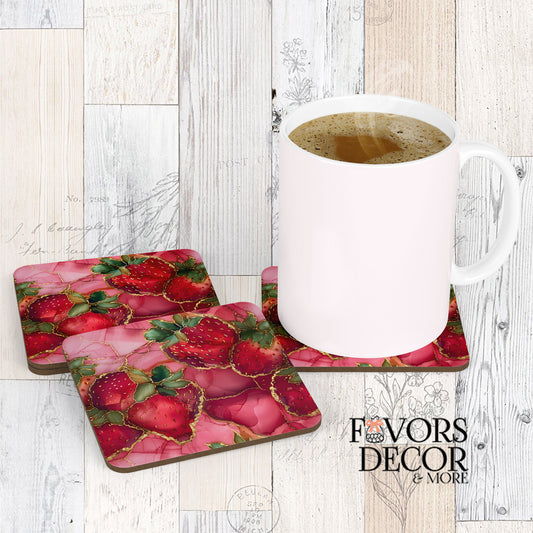 Three Jewelberry Coasters arranged with a white coffee mug sitting on one, showcasing the vibrant design of red strawberries on a marbled pink background with gold accents, against a rustic white wood backdrop.
