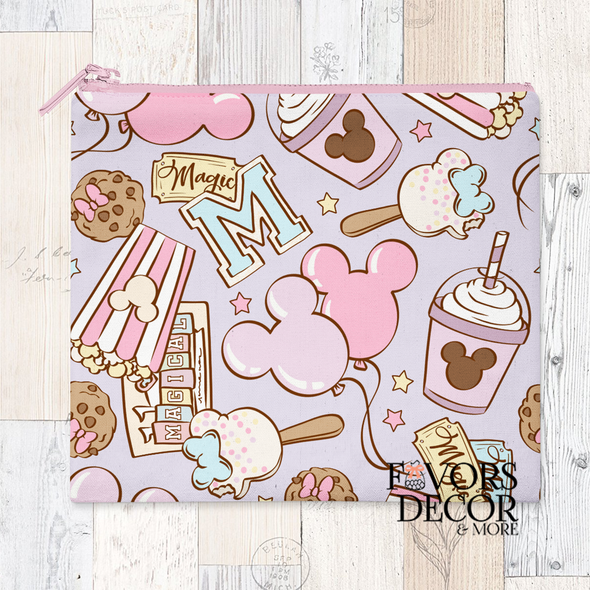 A reusable pouch with a pastel-colored pattern of Disney-inspired treats, including Mickey Mouse shaped ice cream bars, whipped drinks, cookies, popcorn, and balloons. The pouch has a pink zipper closure.