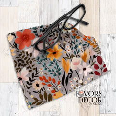 Autumn-inspired lens cloth featuring orange, yellow, teal, and ivory florals on a taupe background, styled with black eyeglasses.