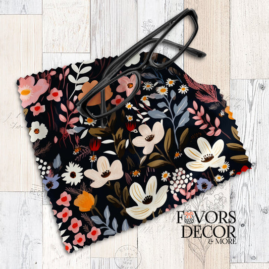 Dark floral lens cloth with ivory, pink, and red flowers on a navy background, styled with black eyeglasses.