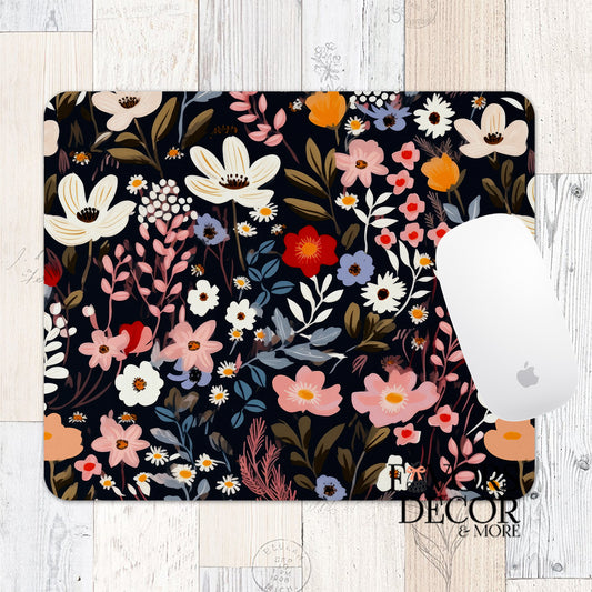 Mouse pad with Midnight Garden floral design featuring blush, ivory, and red flowers on a dark navy background, styled with a white mouse.