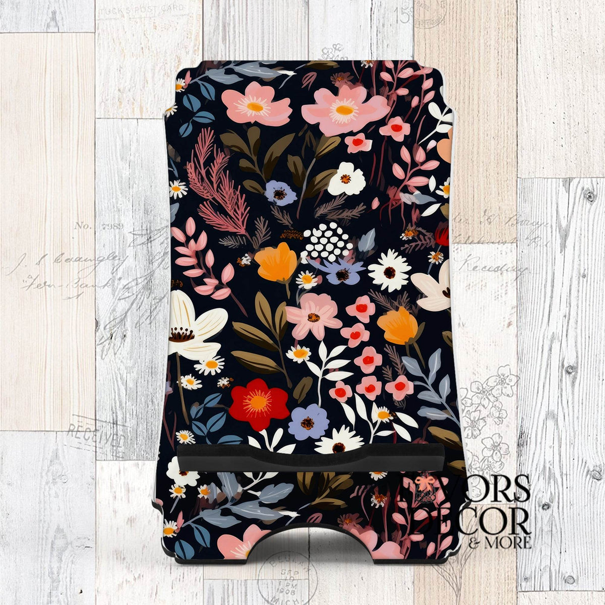 Phone stand with dark floral Midnight Garden design featuring red, blush, ivory, and blue flowers on a navy background.