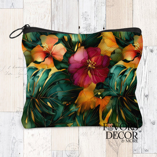 Monstera Drift Pouch with a vibrant watercolor pattern of green monstera leaves, orange and magenta flowers, and gold accents, with a black zipper.