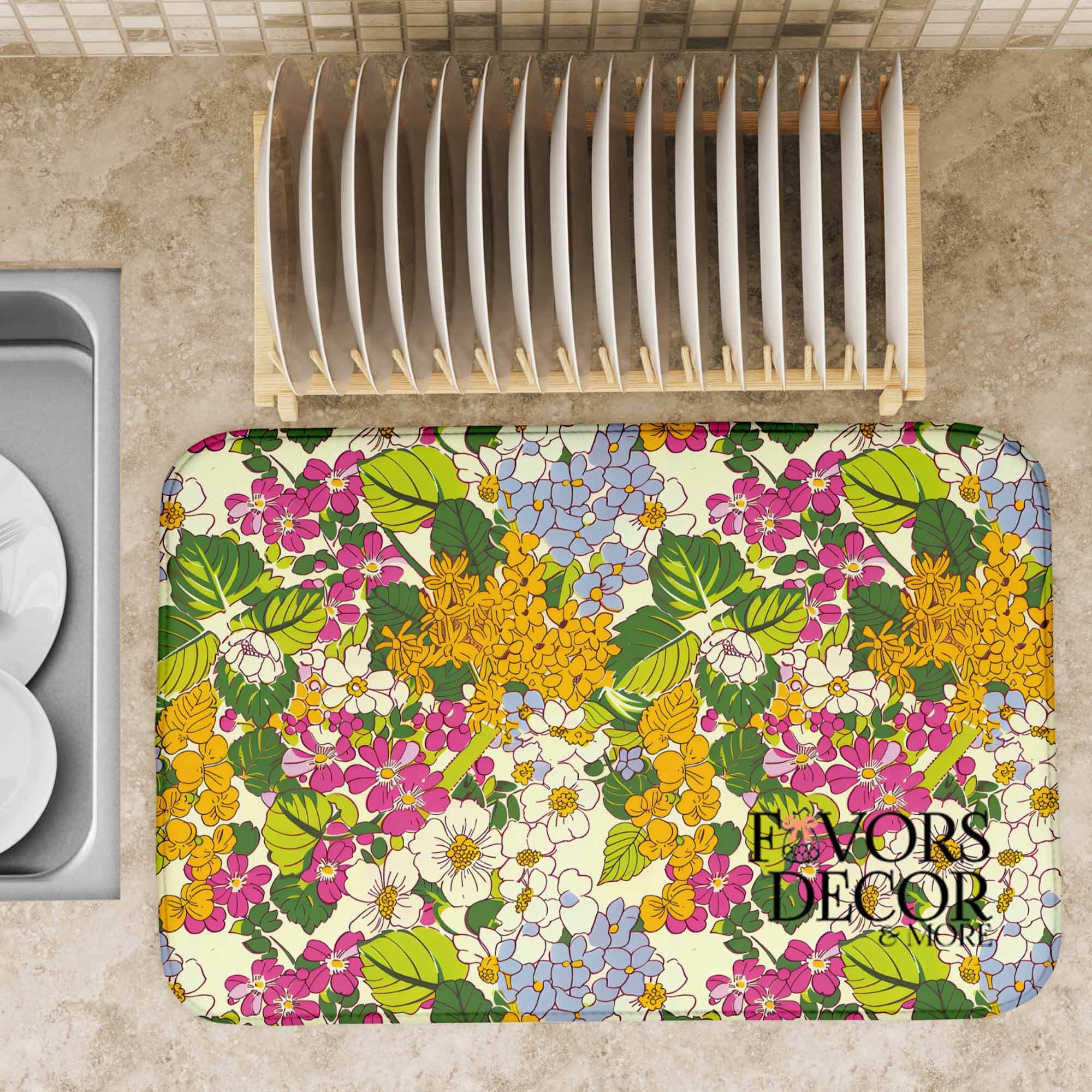 Floral patterned mat on a kitchen floor with a plate rack above it.