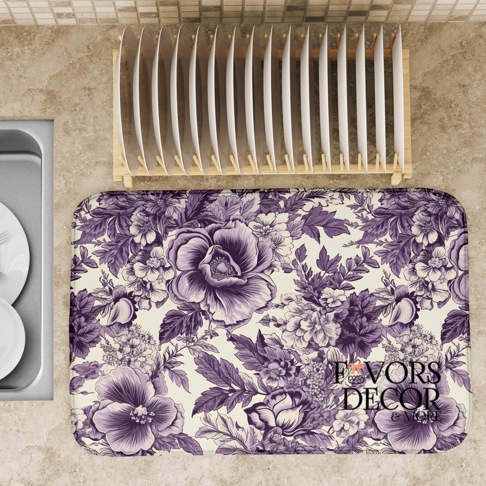 Dish drying mat with detailed purple floral design on a kitchen counter, styled with plates and a dish rack