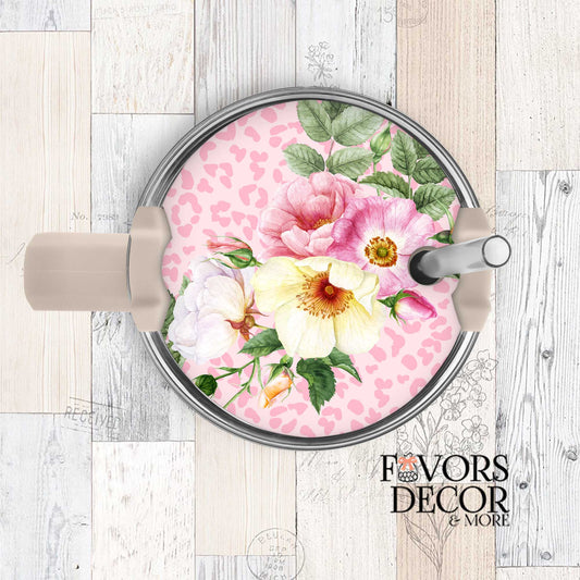 Stanley tumbler lid topper with pink and yellow watercolor florals on a pink leopard print background, shown on a beige tumbler with Favors Decor &amp; More branding.