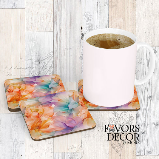 Three Sorbet Dreams Coasters with a white coffee mug sitting on one, showcasing a soft abstract watercolor design with blended pastel shades of orange, peach, purple, and teal.