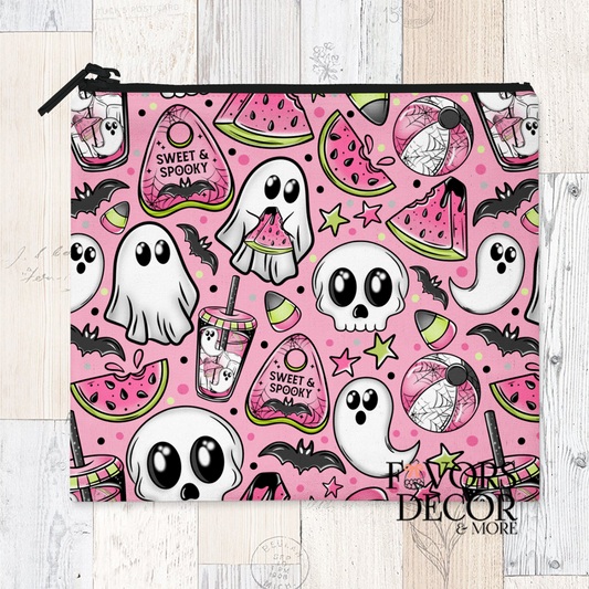 Reusable sandwich pouch with cute ghosts, skulls, bats, and watermelon slices on pink background