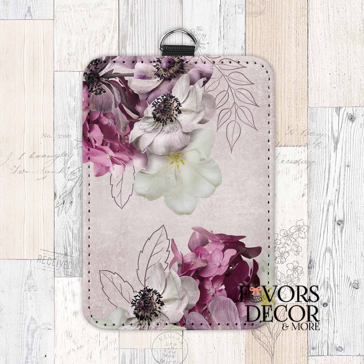 Card holder with soft lavender floral design, featuring white, pink, and purple flowers on a textured background with line-drawn leaves and clip attachment.