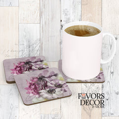 Square cork-backed coasters with violet and ivory floral design on a muted lavender background, styled with a coffee mug on wood surface