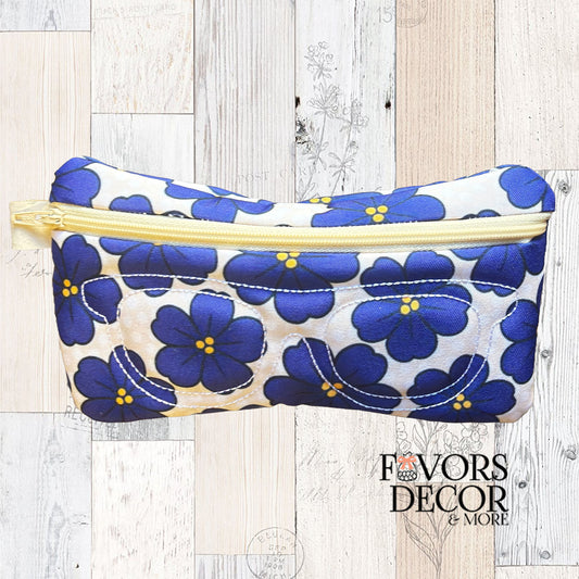 Violet Virtue eyeglass pouch with cobalt African violets, yellow zipper, and stitched glasses outline on a cream background.