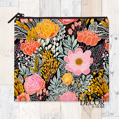A reusable sandwich pouch featuring a black and white abstract botanical or leaf pattern on the exterior. The pouch has a white zipper closure and is made with a food-safe PUL fabric lining.